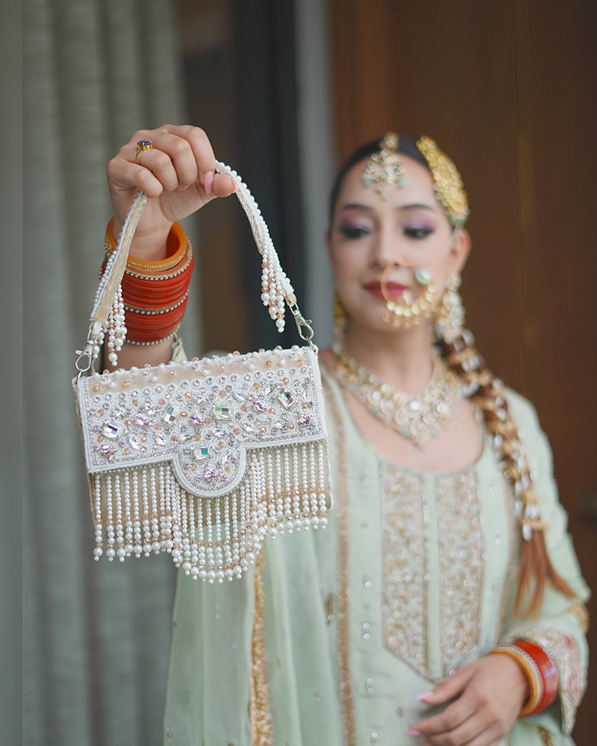 Pearl Grace Embellished Tassel Clutch